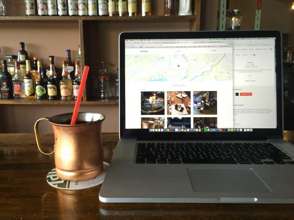 working remotely at cafe or coffee shop with laptop