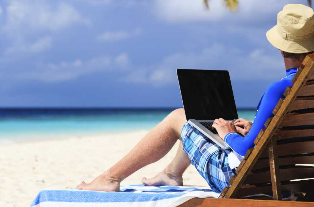 man with laptop on tropical vacation 000045135034 medium
