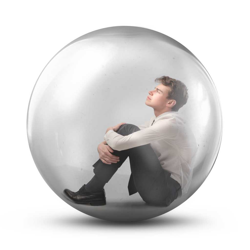 Young man in a plastic bubble isolated