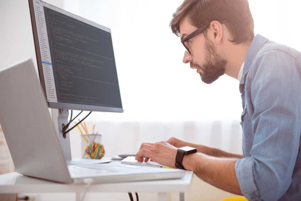 Hipster millennial working on computer